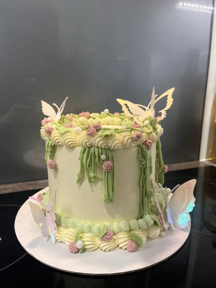 Pastel birthday cake with butterfly decorations