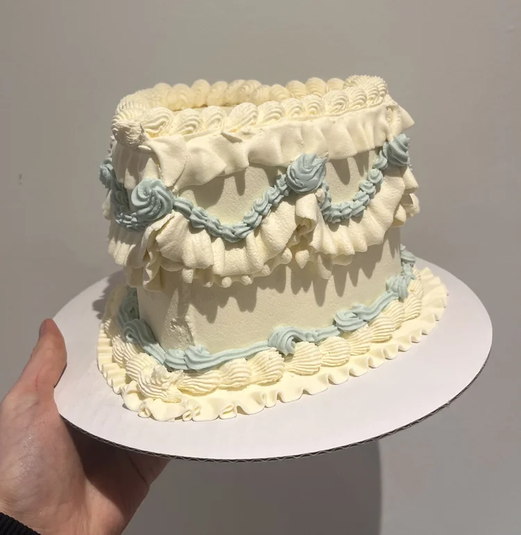 Retro-style birthday cake with blue ruffles