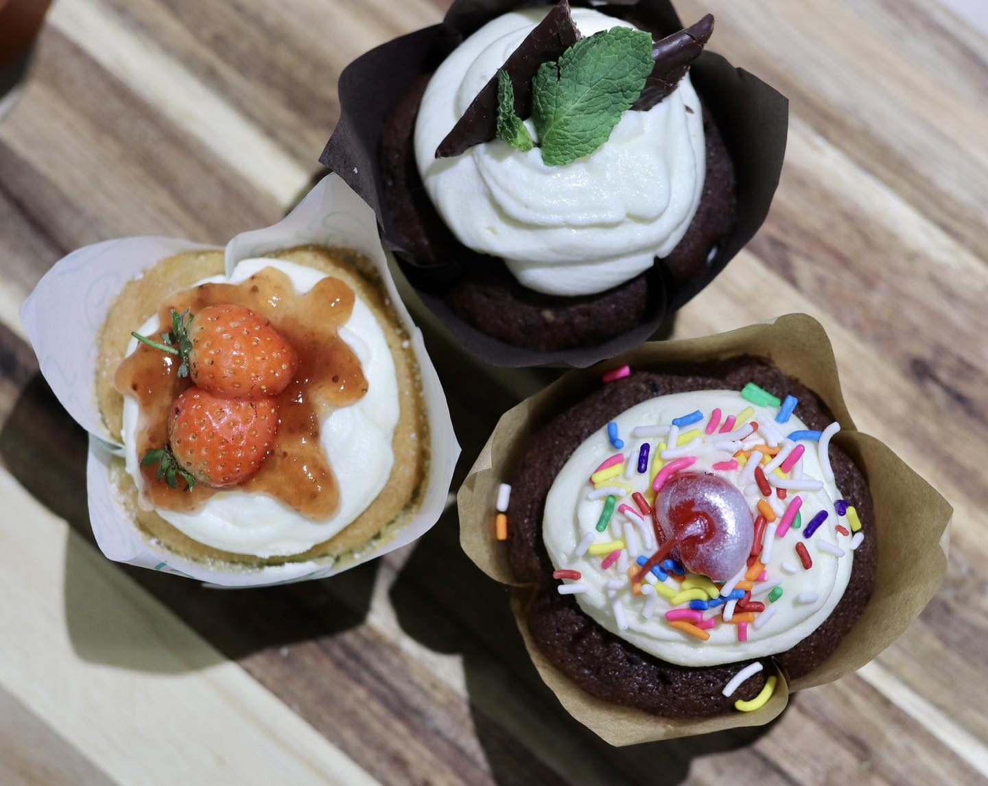 Assorted cupcakes with various toppings
