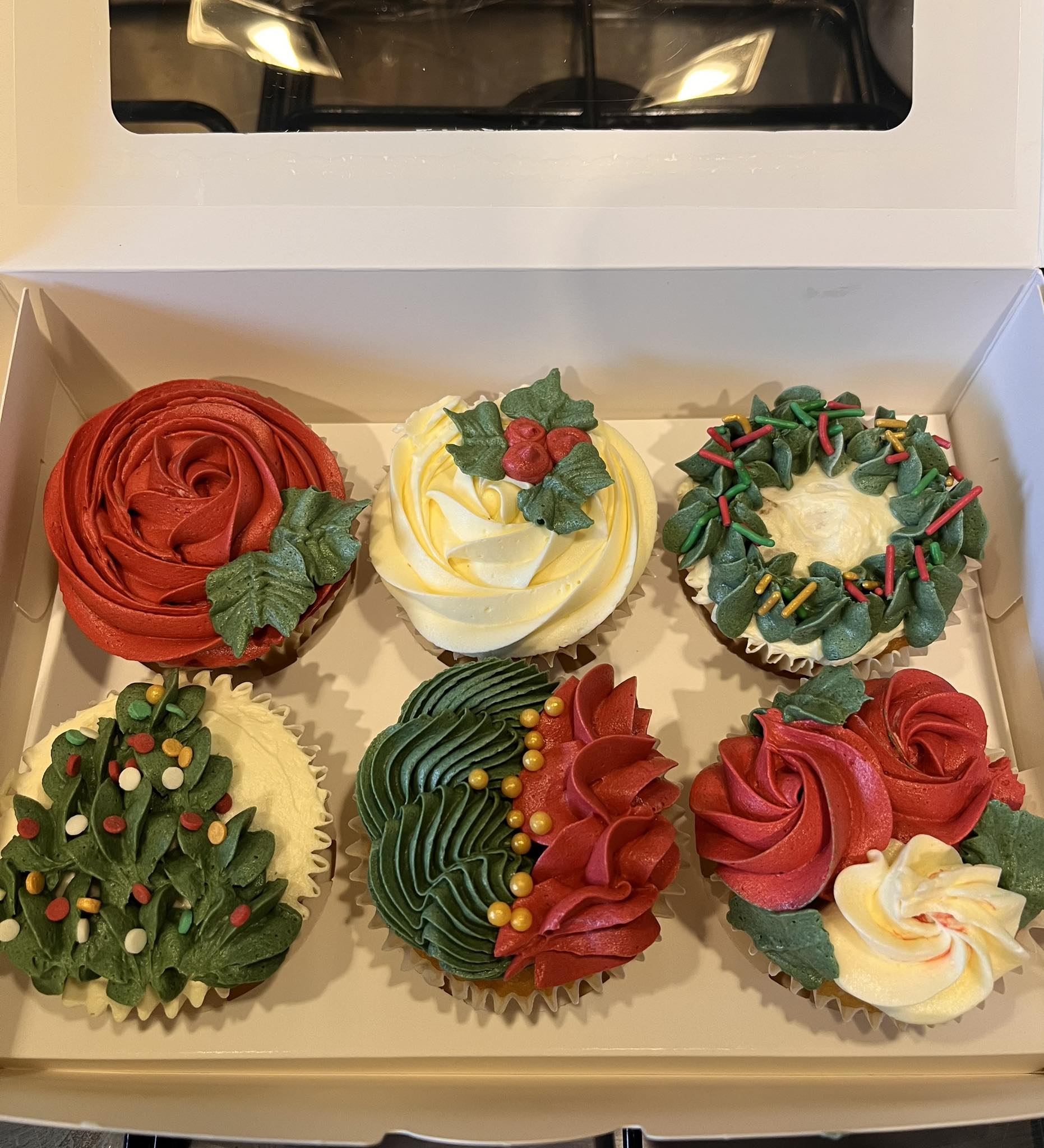 Christmas themed cupcakes in a box